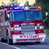 Fire truck with 9/11 banner driving