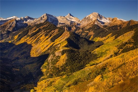 Scenic background in autumn with colorful trees and mt daly