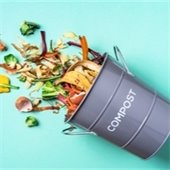 Compost bucket spilled over with food scraps